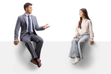 Father and teenage daughter sitting on a panel and talking