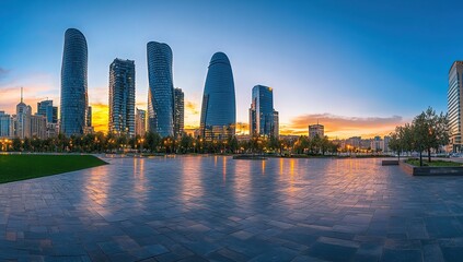 Fototapeta premium Modern City Skyline at Sunset with Water Reflection