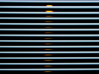 Venetian blinds with light and dark shadows closeup abstract
