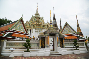 Fototapeta premium Beautiful Thai architecture of pagoda and building at Wat Phra Chetuphon or Wat Pho, which is an important temple, is large and has many Buddhists and tourists visiting.Located at Bangkok city.