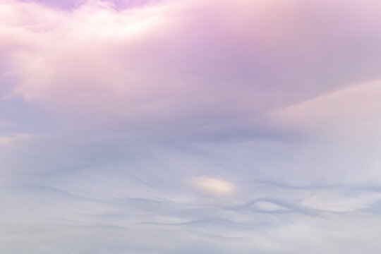 Soft pastel sky with gentle cloud formations