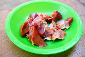 raw chicken liver on a plate. Fresh food 