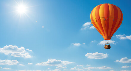 Obraz premium Colorful Hot Air Balloons Soaring Through Blue Sky and Clouds During Summer Adventure