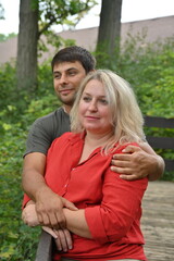 Naklejka premium blonde woman with dark-skinned man,