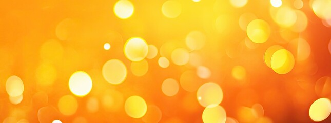 Fototapeta premium Abstract orange and yellow blurred background with bokeh lights. Background for a banner