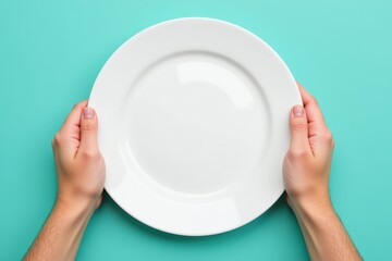 A Close-up of Hands Holding a Clean, Empty White Plate Against a Bright Teal Background, Perfectly Highlighting the Simple Elegance of Minimalism in Kitchenware