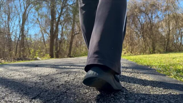 low view of woman walking away from camera