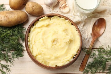 Delicious mashed potato on white wooden table, flat lay