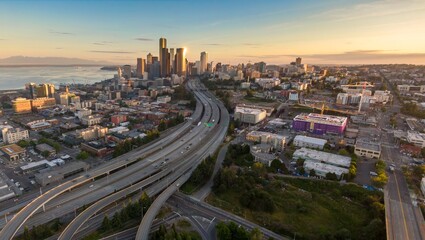 Seattle skyline at sunrise, freeway traffic, urban development. Downtown, Seattle, Washington, USA