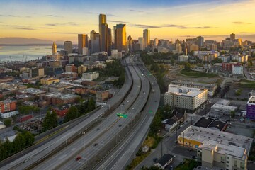 Seattle skyline at dawn, freeway traffic, urban development. Downtown, Seattle, Washington, USA