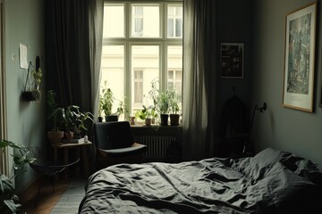 Dark moody bedroom with plants, window, and bed.