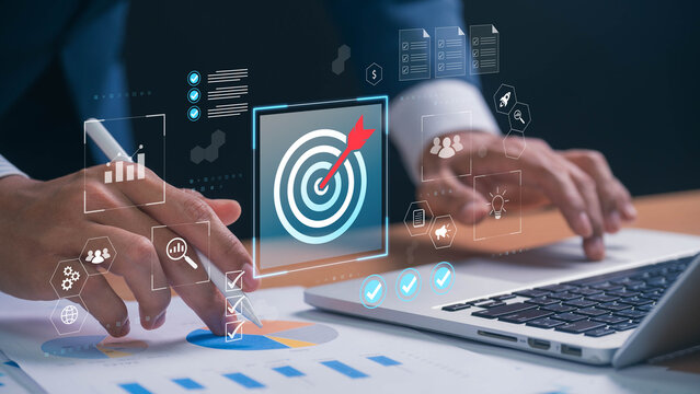 Business goal setting and strategic planning. professional analyzing financial reports and business analytics, with a glowing target and performance tracking in corporate strategy.