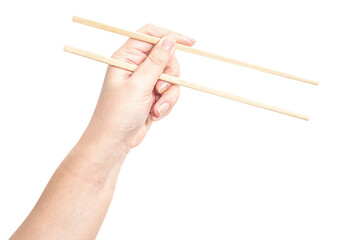 Female hand holding a wood chopstick isolated on white background.