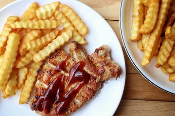 Pork steak grilled barbecue and french fries