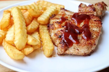 Pork steak grilled barbecue and french fries
