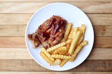 Pork steak grilled barbecue and french fries
