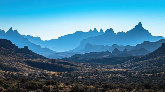 Bathing the chisos mountains in stunning blue light, early morning reveals the rugged beauty national park, highlighting its vast desert landscape and dramatic rock formations