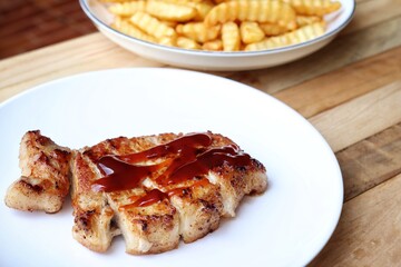 Pork steak grilled barbecue and french fries