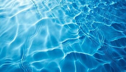 Obraz premium 抽象的な爽やかな透明な水の影表面 テクスチャ 青の背景に自然な波紋のクローズアップ