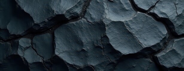Charcoal grey schist stone with rugged texture and subtle veins of dark minerals, rock, charcoal grey, natural stone