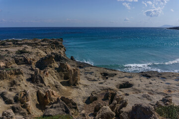 Petrified tree trunks at beautiful landscape of Geopark of Agios Nikolaos Petrified Forest at mediterranean sea coast, Laconia, Peloponnese, Greece