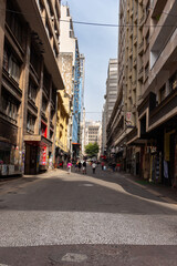 Fototapeta premium SÃO PAULO, SP, BRAZIL - JULY 27, 2024: Dom José de Barros street, exclusively for pedestrians, seen from São João avenue in the city center.