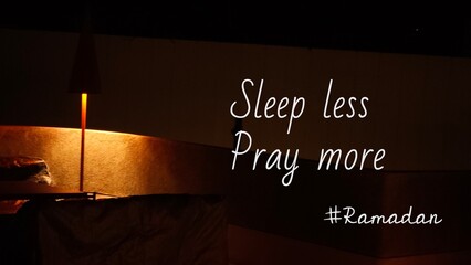 Inspirational and motivational quote about Ramadan, the holy month - Sleep less pray more at Ramadan. Outdoor aesthetic city light at night background.