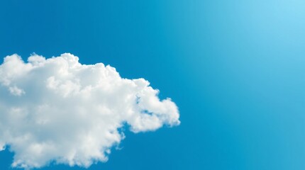Large Fluffy Cloud in a Bright Blue Sky
