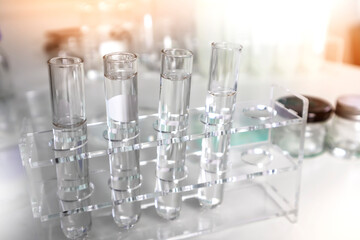 Clear bottles and dishes are used in scientific and medical experiments.