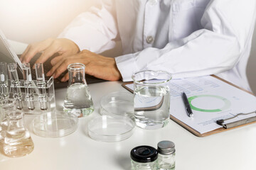 Researchers study data and conduct chemical experiments, in the creation of drugs, scientific data collection experiments