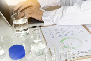 Researchers study data and experiment with chemicals, scientific process, record results and report research.