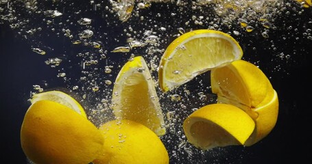 Citrus Splashes Enjoy Fresh and Zesty Lemons Floating in Refreshing Water, Full of Life