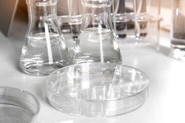 Clear bottles and dishes are used in scientific and medical experiments.