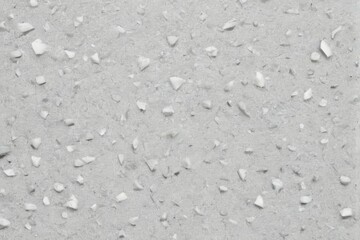 Fototapeta premium Closeup of textured surface with small irregularly shaped light grey particles in uniform pattern for Adobe Stock.