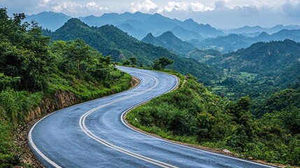 Fototapeta premium Winding Scenic Road Through Mountains Nature Landscape Lush Green Environment Serene Viewpoint
