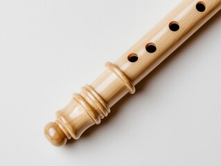 Fototapeta premium Detailed close up of a wooden recorder instrument isolated on a white background, musical aesthetic