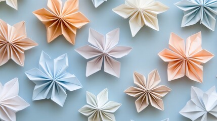 Delicate Pastel Paper Flowers on Soft Blue Background Display