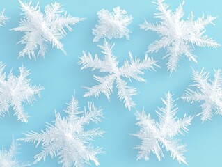 White snowflakes on a light blue background. Winter holiday background with delicate ice crystals. Abstract snow pattern for Christmas design.