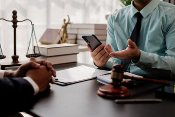 law and justice. Lawyer Legal counsel presents to the client a signed contract with gavel and legal law. justice and lawyer Business partnership meeting concept.
