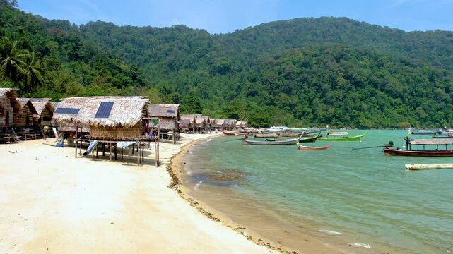 Explore the tranquil shores of Surin Island Thailand, where tropical landscapes meet traditional village life. Experience the harmonious blend of nature and culture at the Moken villag