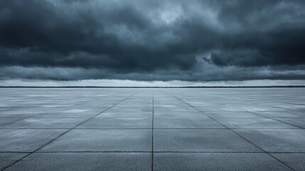 Dark Stormy Sky Over Distant Cityscape and Empty Pavement