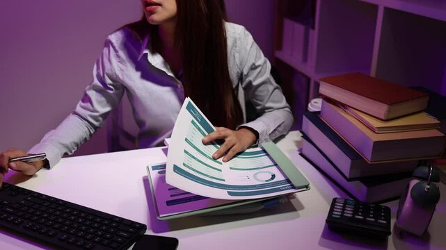 a businesswoman works late into the night because she has to deal with important contract documents that ned to be presented tomorrow, one of the employees worked overtime