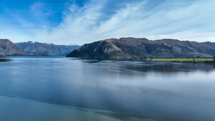 Aerial views of Glendhu Bay coastline at Lake Wanaka on a beautiful sunny day