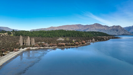 Aerial views of Glendhu Bay coastline at Lake Wanaka on a beautiful sunny day