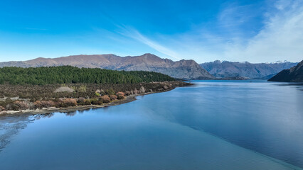 Aerial views of Glendhu Bay coastline at Lake Wanaka on a beautiful sunny day