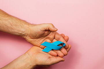 Support awareness campaign with blue ribbon symbolizing cancer detection