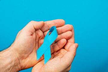 Blue ribbon represents support for health causes and cancer awareness