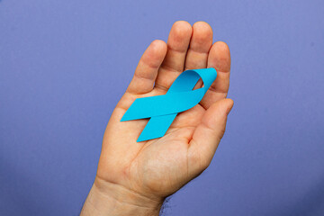 Raising awareness for cancer detection and support with blue ribbon campaign