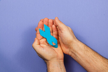 Blue ribbon symbolizes support for cancer awareness and treatment initiatives