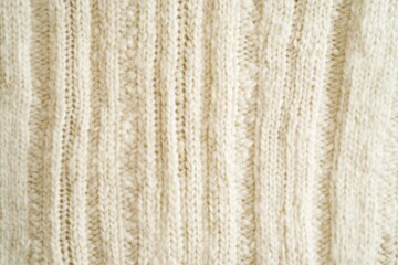 Soft textured knit fabric with a ribbed pattern is displayed